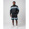 Model wearing the black jacket and shorts set with white and blue stripes