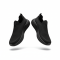 All-black knit slip-on sneakers with chunky black sole pair on white background