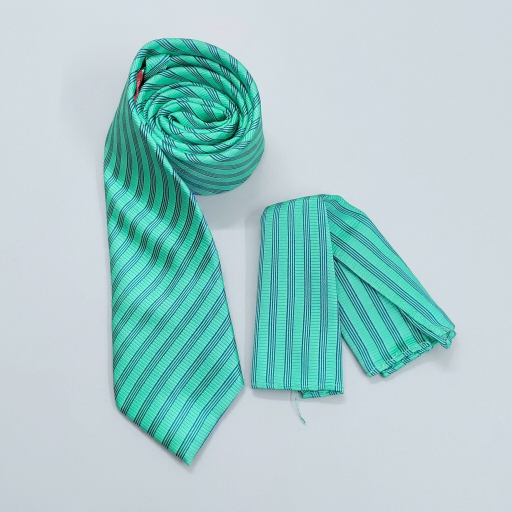 Mint-green and blue striped tie with matching pocket square on a neutral background