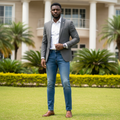 Nigerian male model wearing men's clean wash slim jeans - front view