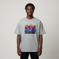 Black Nigerian male model wearing a grey Japanese car graphic T-shirt