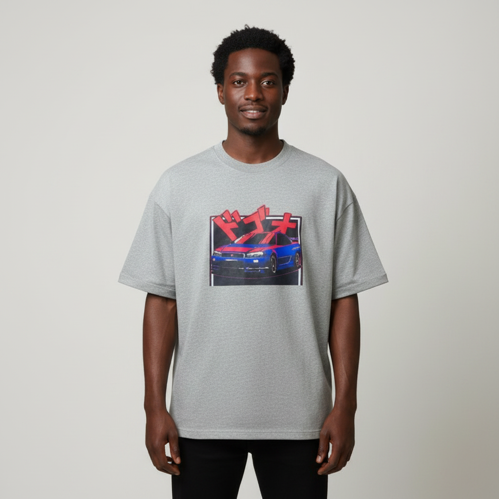 Black Nigerian male model wearing a grey Japanese car graphic T-shirt