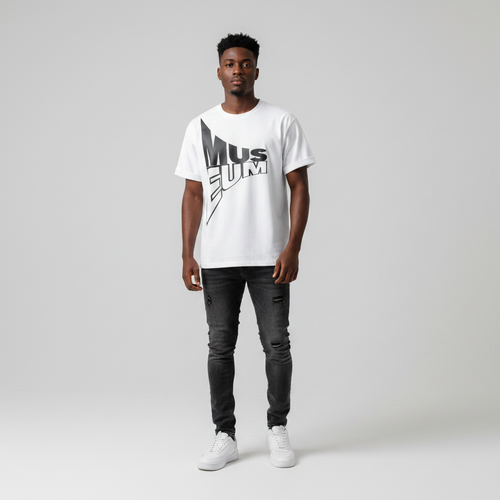 Young Nigerian male wearing white oversized Museum bold typography graphic crew neck tee