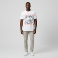Model wearing the white tropical beach print tee