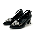 Matching black jewel-cluster ankle-strap block heels together