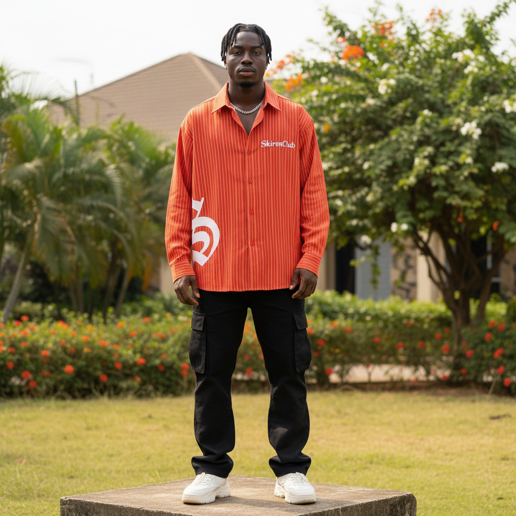 Nigerian male model wearing red striped oversized gothic graphic long-sleeve shirt – full body lifestyle shot