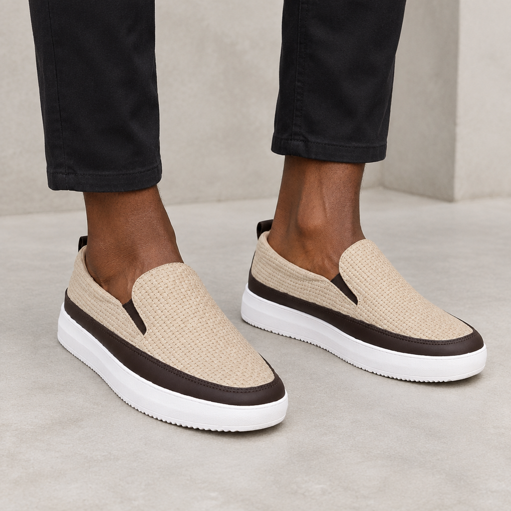 Beige textured slip-on shoes worn on both feet