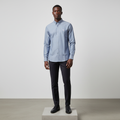 Nigerian male model wearing steel blue plain long-sleeved shirt, front view