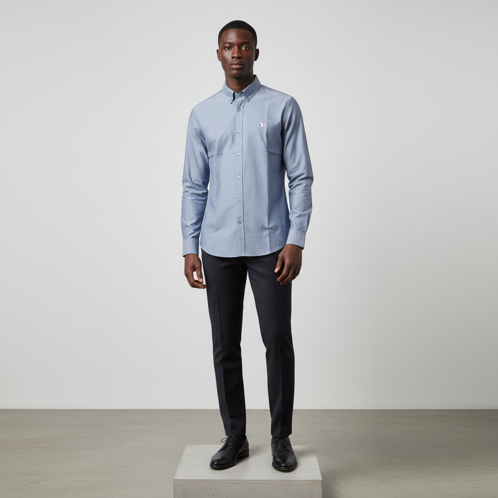 Nigerian male model wearing steel blue plain long-sleeved shirt, front view