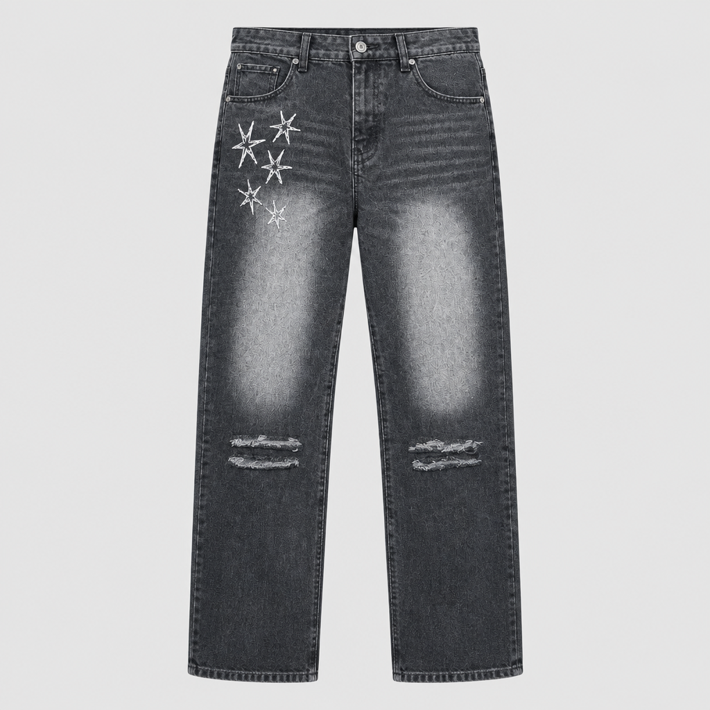 Charcoal-grey straight jeans with white starburst embroidery and distressed knees