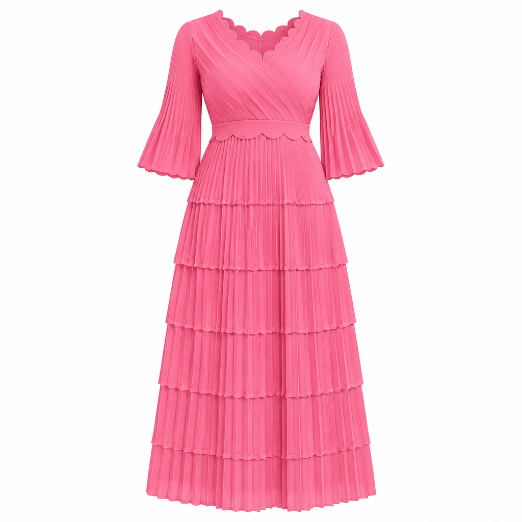 Bright pink scalloped tiered pleated dress on white background
