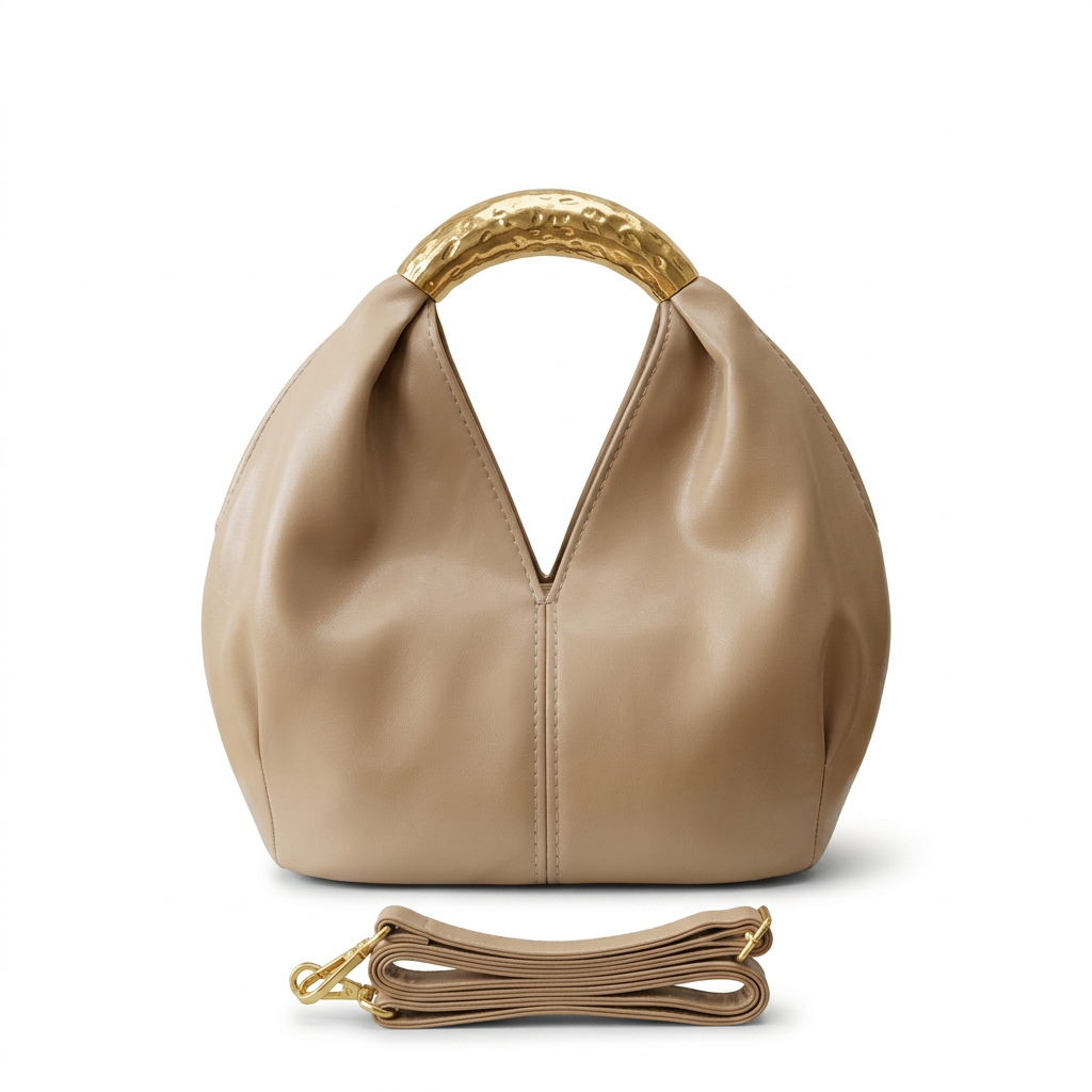 Warm-cream rounded handbag without label with gold-tone handle and matching strap on white