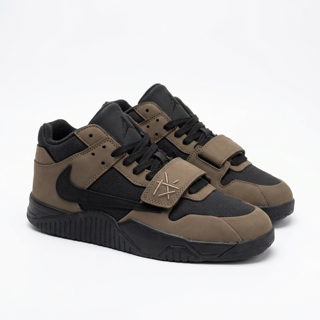 Pair of taupe and black strap sneakers on a white background