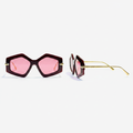 Women's oversized geometric sunglasses with burgundy frame, gold ribbed temple hardware and bright pink lenses – front and side ghost mannequin view on white background