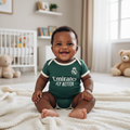 Nigerian baby wearing dark green & cream football romper bodysuit lifestyle shot