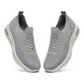 Pair of light-grey patterned knit sneakers on white