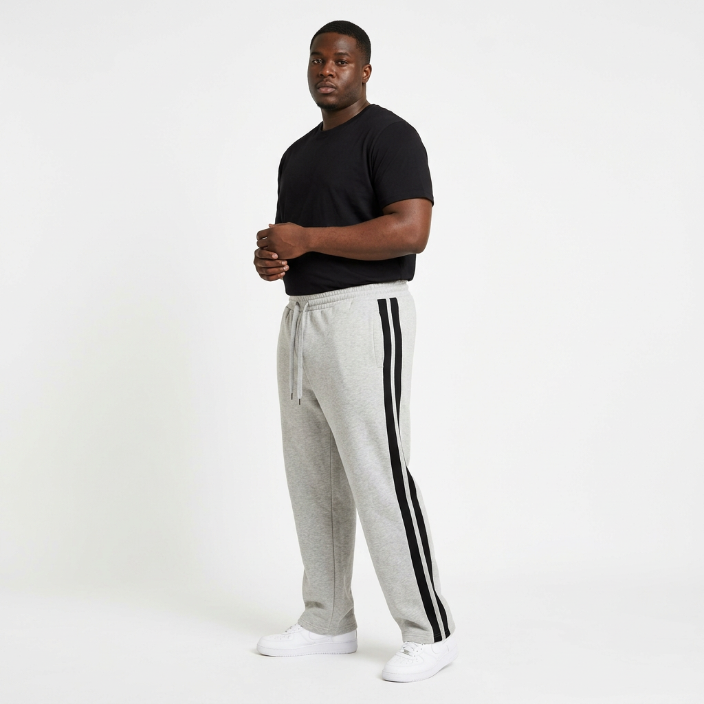 Adult Black model wearing grey marl joggers with black side stripes