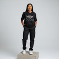 Nigerian female model front view wearing black rhinestone graphic T-shirt