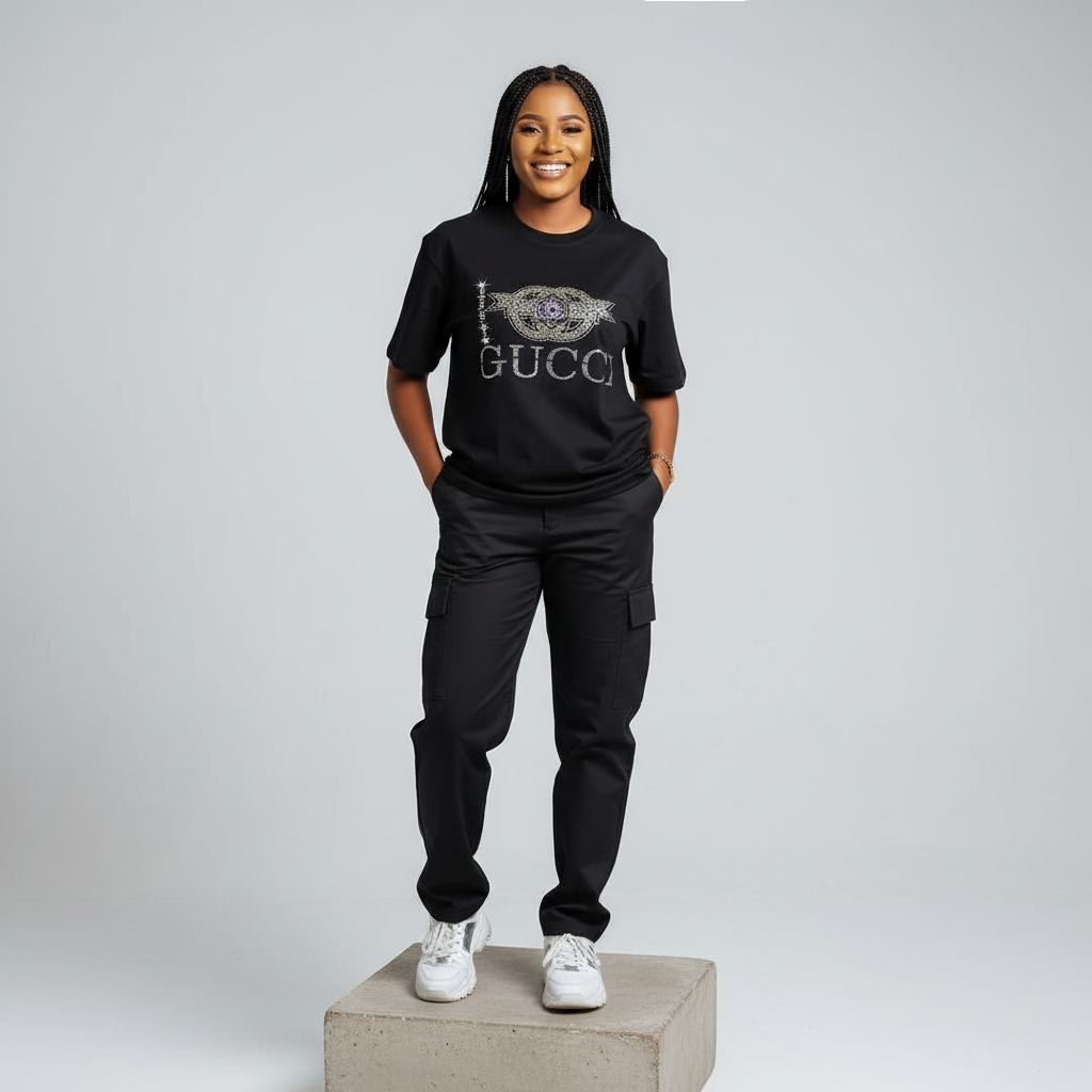 Nigerian female model front view wearing black rhinestone graphic T-shirt