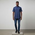 Nigerian male model wearing navy blue tonal plaid short-sleeved shirt