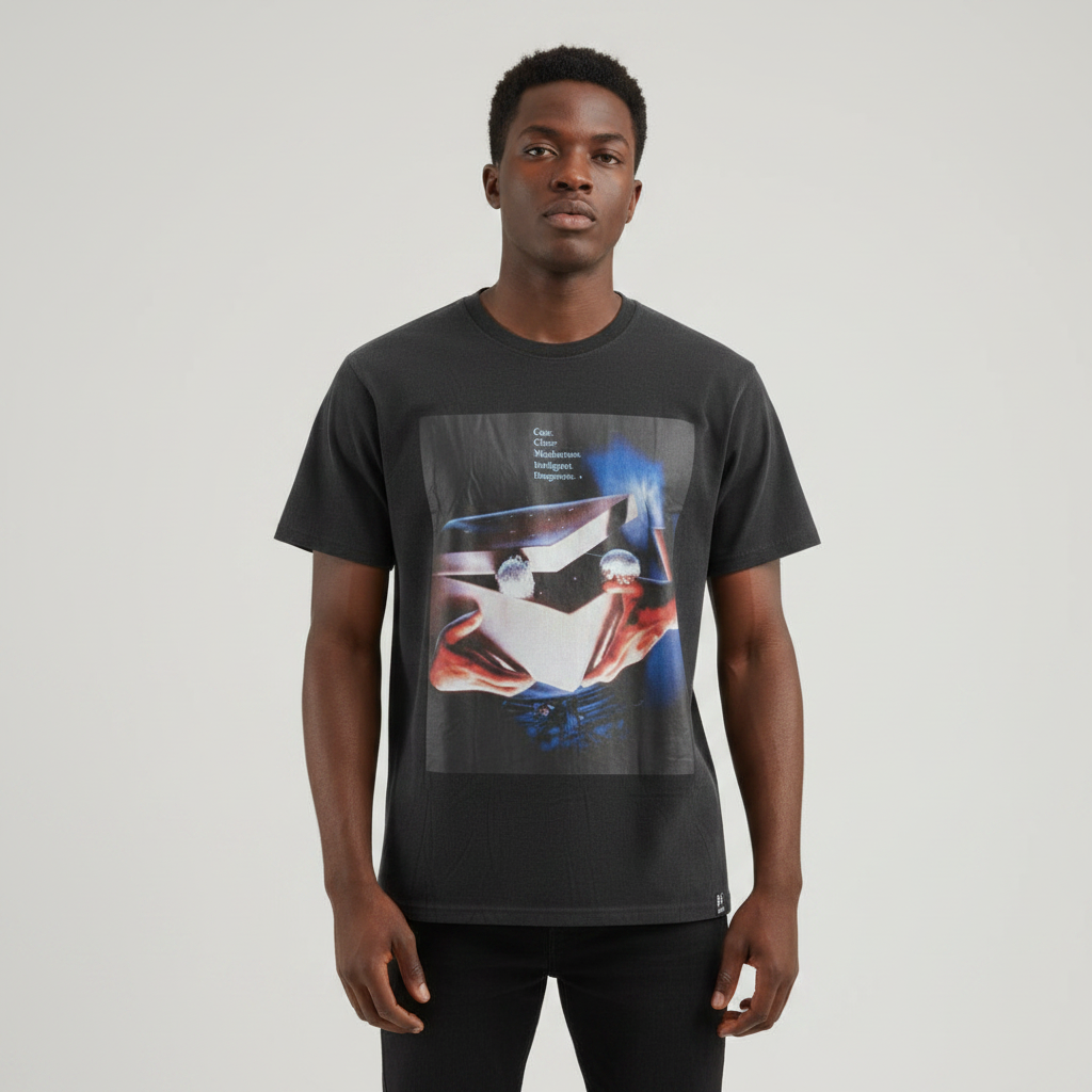 Young Nigerian male wearing washed black Gremlins vintage movie poster graphic crew neck tee