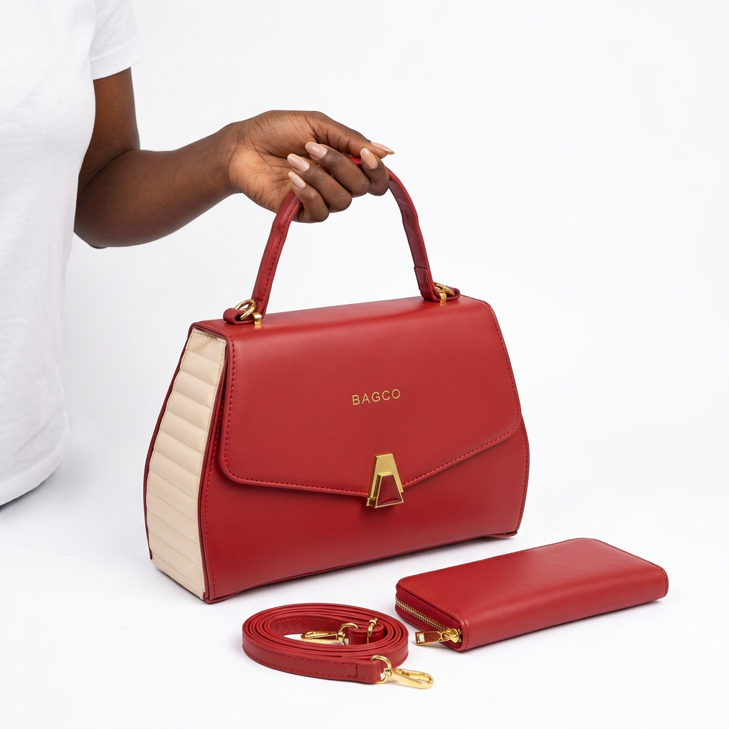 Hand holding a red handbag with cream ribbed sides and matching accessories