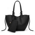 Black sculptural tote and matching zip pouch on white