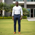 Nigerian male model wearing navy blue chino trousers in outdoor setting