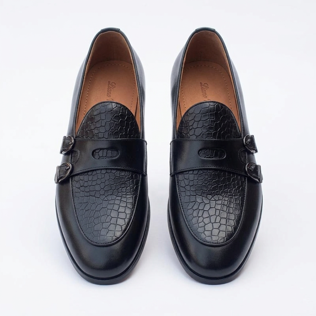 Straight-on black crocodile-effect loafers with twin dark buckles
