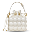 Front view of white circle-appliqué drawstring bucket bag on white background