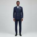 Nigerian male model wearing men's navy blue double-breasted suit with gold buttons and tie