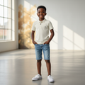 Nigerian boy model wearing cream polo shirt