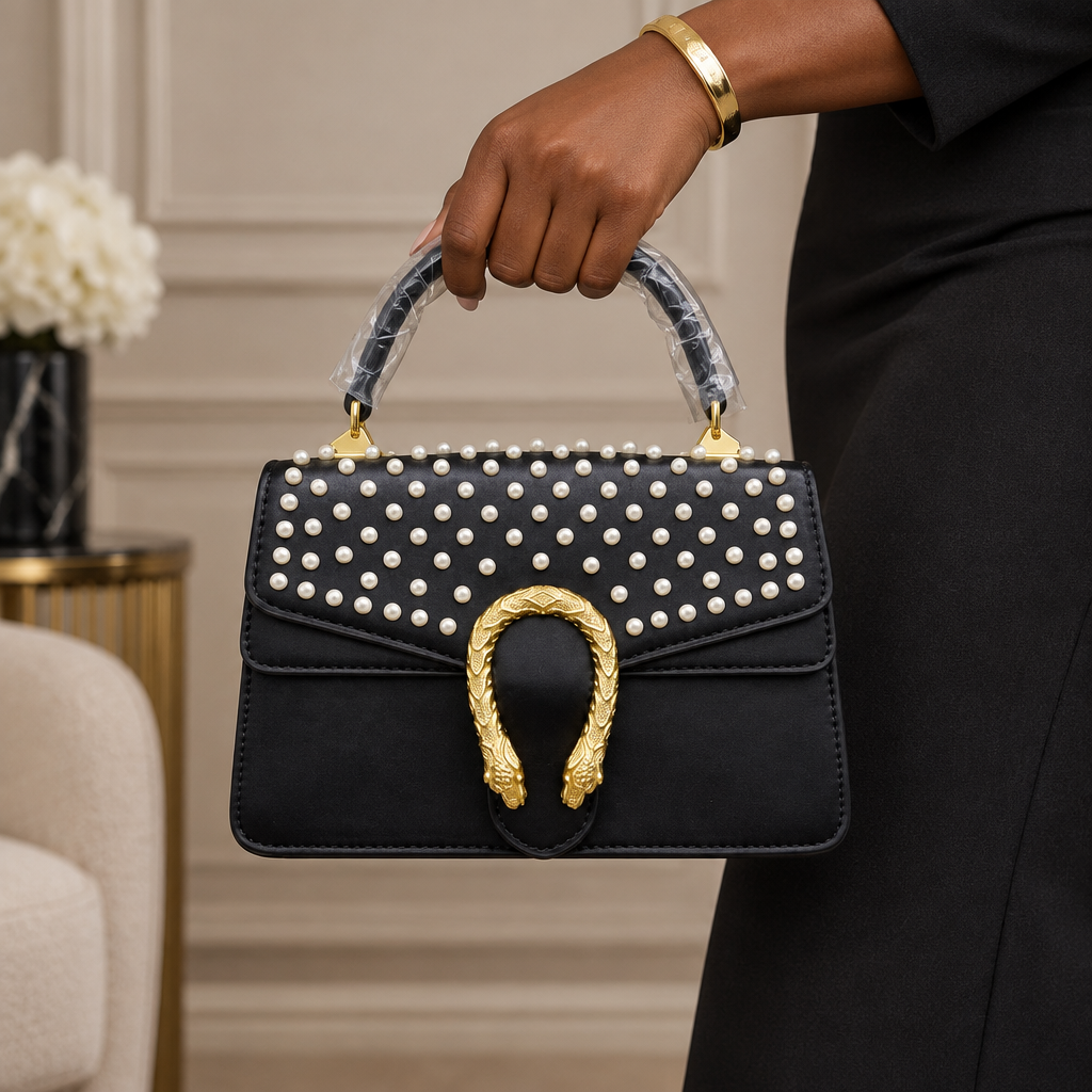 Black Nigerian woman holding a black pearl-embellished handbag