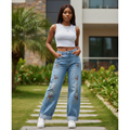 Women's light blue glitter wide-leg jeans with butterfly and floral embroidery — Nigerian female model lifestyle shot