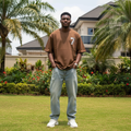 Nigerian male model wearing chocolate brown airplane numeral graphic tee – front view
