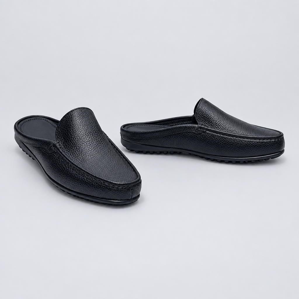 Men's black pebble grain backless mule slippers with driving sole, front and side view