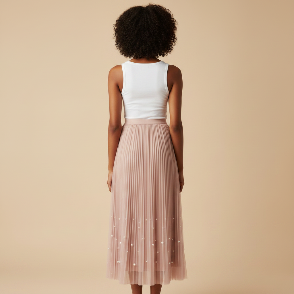 Nigerian woman wearing blush pink pearl hem pleated midi skirt - back view