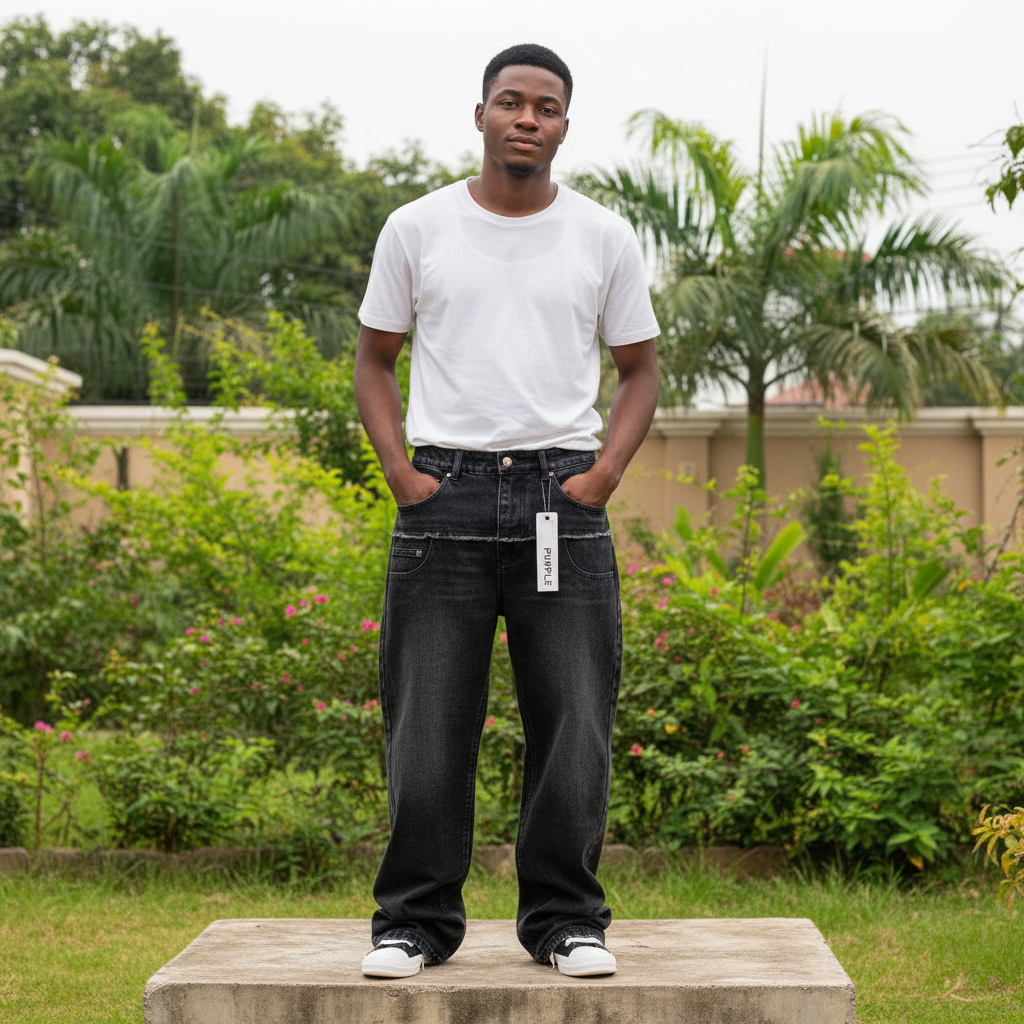 Nigerian male model full body wearing men's black washed wide-leg double waistband denim jeans