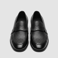 Men's black leather loafers with perforated detailing and woven-texture strap, front view
