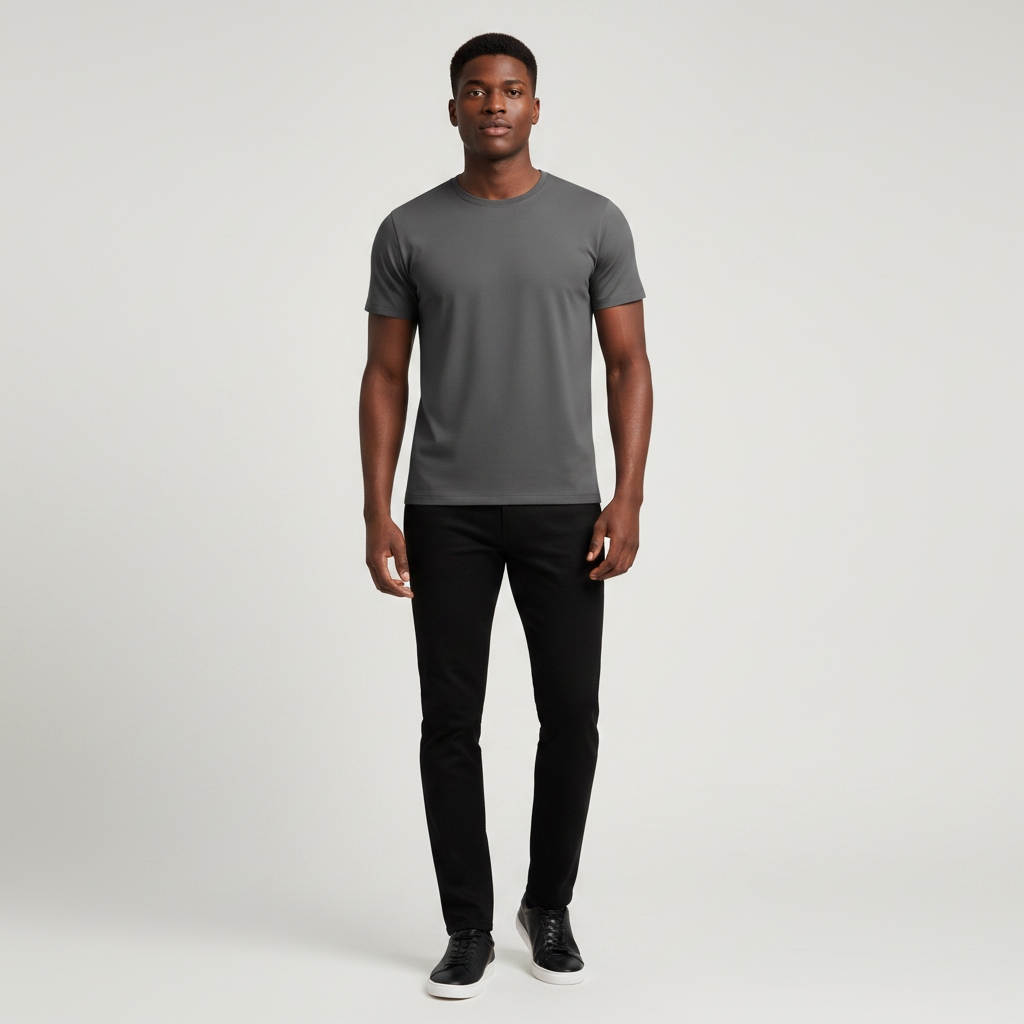 Young Nigerian male wearing dark charcoal grey plain slim fit crew neck tee