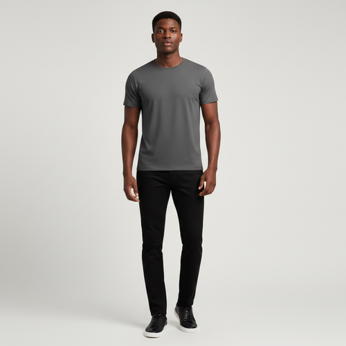 Young Nigerian male wearing dark charcoal grey plain slim fit crew neck tee