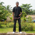 Nigerian male model full body wearing men's black pink rhinestone script flared denim jeans