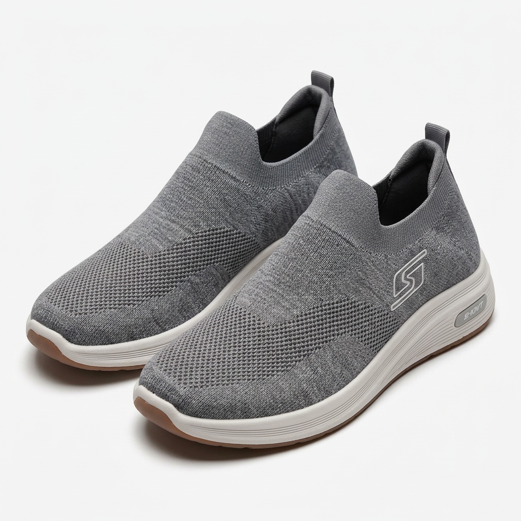 Pair of grey knit slip-on sneakers on white