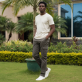 Nigerian male model wearing olive khaki cargo pants with side pockets