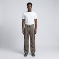 Full-body male model wearing taupe cargo trousers