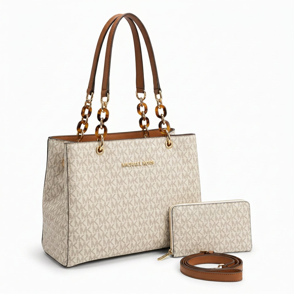 Ivory monogram tote with brown chain-link handles, matching purse and separate brown strap on white