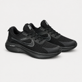 Pair of black mesh running sneakers with gray side detailing and black soles