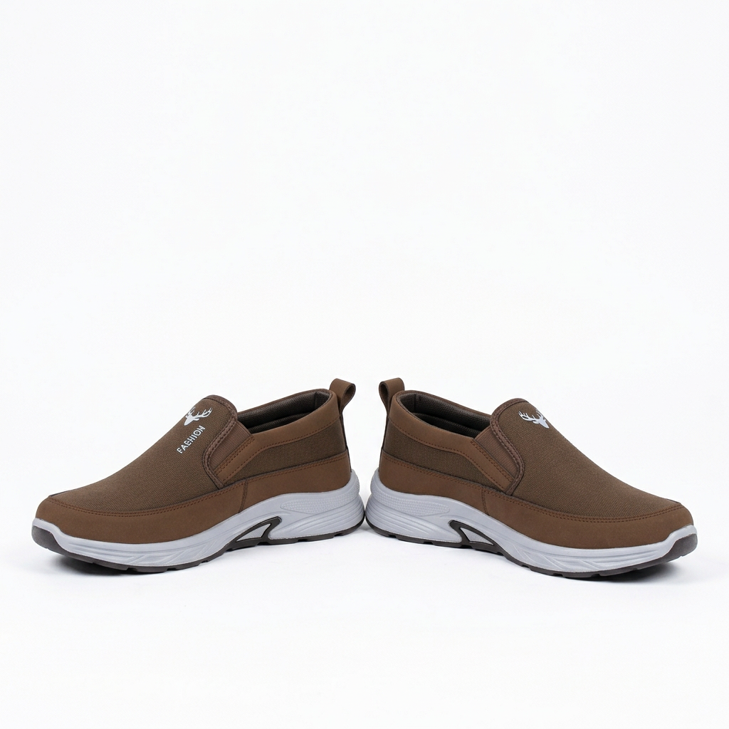 Brown contrast-sole slip-on shoes, pair on a white background