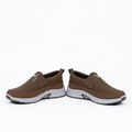Brown contrast-sole slip-on shoes, pair on a white background