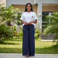 Nigerian female model wearing white smiley graphic oversized tee and navy wide-leg palazzo trouser co-ord set